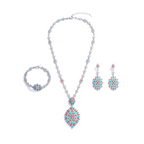 Jewelry set with necklace, earrings, and bracelet on a white background