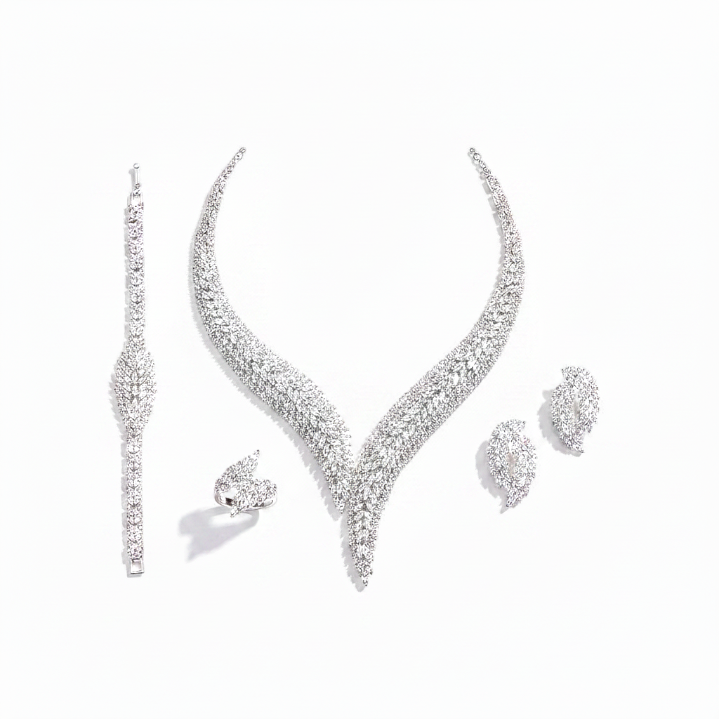 Silver jewelry set with necklace, earrings, and bracelet on a white background