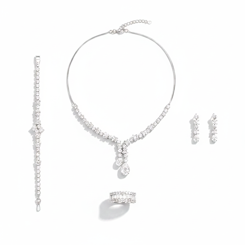Silver jewelry set with necklace, bracelet, ring, and earrings on a white background