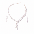 Zircon tear drop necklace and earrings set on a white background