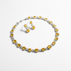 Jewelry set with yellow gemstones on a white background