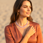 Woman wearing a purple beaded necklace with a blurred background