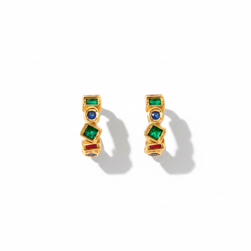 The Accessory Bar The Bana gold-plated C-hoop earrings featuring multi-coloured cubic zirconia stones.