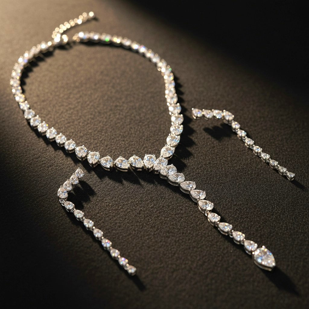 The Accessory Bar Doha set featuring a silver-tone necklace and drop earrings with clear pear-cut cubic zirconia.