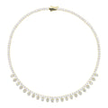 The Accessory Bar Hessa gold-plated tennis choker with pavé cubic zirconia and dangling heart-shaped stone accents.