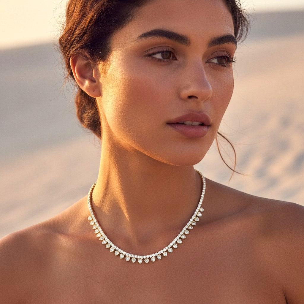 The Accessory Bar Hessa heart-detail tennis choker in gold-plated brass with pavé-set cubic zirconia on a model