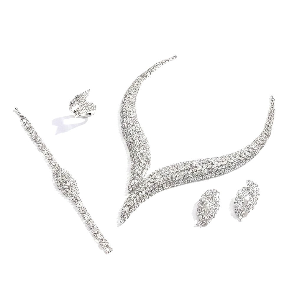 The Accessory Bar Layla bridal jewelry set featuring a rhodium-plated necklace, drop earrings, ring, and tennis bracelet.