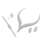 The Accessory Bar Layla bridal jewelry set featuring a rhodium-plated necklace, drop earrings, ring, and tennis bracelet.