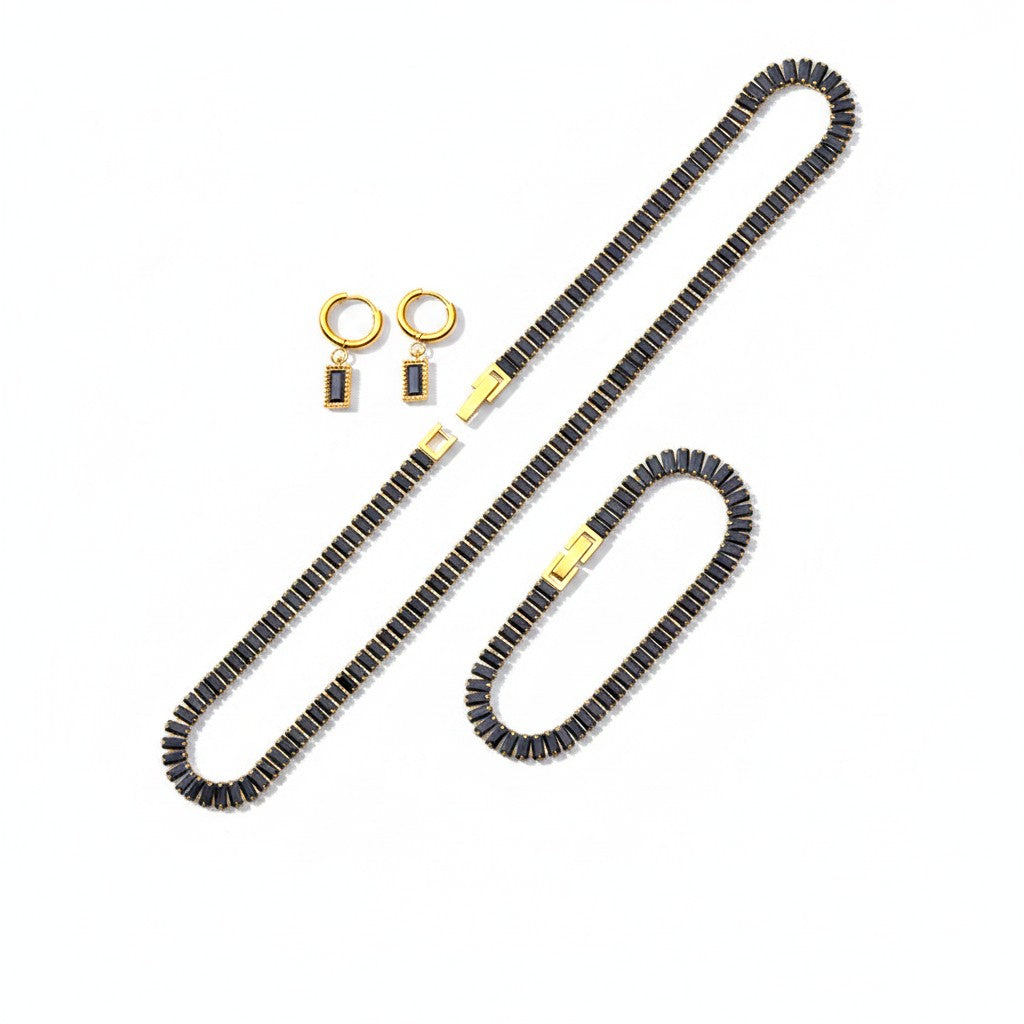 The Accessory Bar Leila set featuring a gold-tone tennis necklace, bracelet, and stud earrings with black cubic zirconia