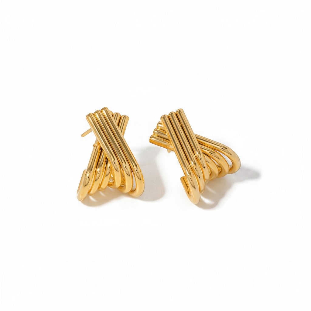 The Accessory Bar Lyra earrings featuring interlocking ribbed arcs in 18K gold-plated stainless steel.