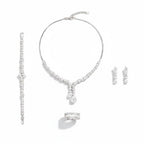 The Accessory Bar Nada 4-piece jewelry set featuring a silver-tone necklace, drop earrings, ring, and bracelet with cubic zirconia.