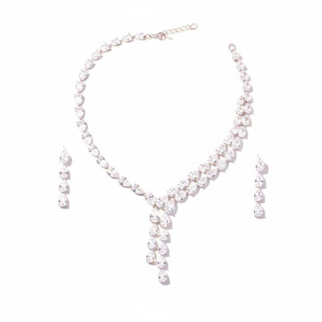 The Accessory Bar Nadia set featuring a silver-tone tennis necklace and matching drop earrings with clear cubic zirconia