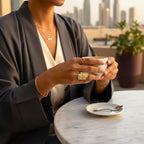 The Accessory Bar Nour wide gold-plated architectural ring with micro pavé cubic zirconia on a woman's hand.