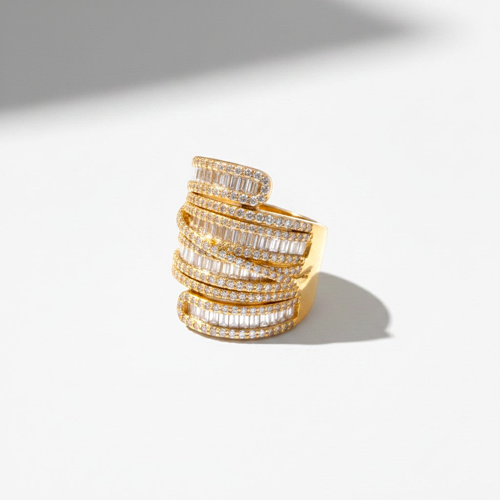 The Accessory Bar Nour wide gold-plated adjustable ring with micro pavé cubic zirconia stones on a white background.