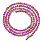 The Accessory Bar Ruba red cubic zirconia tennis chain in 18K gold-plated stainless steel with a box clasp.