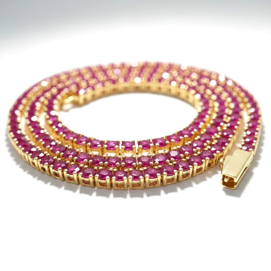 The Accessory Bar Ruba tennis chain featuring 3mm red cubic zirconia stones set in 18K gold-plated stainless steel.