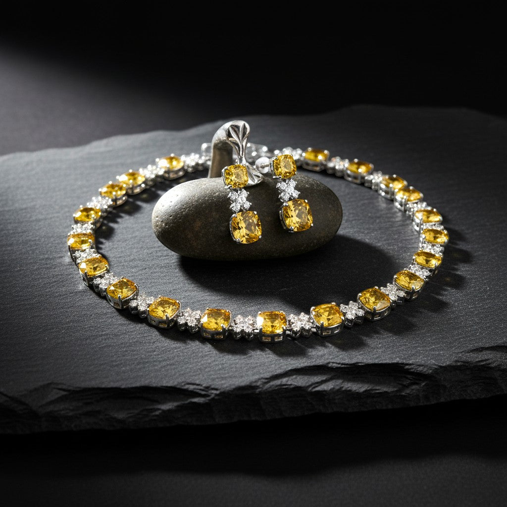 The Accessory Bar Sahara set featuring a citrine yellow cushion-cut necklace and drop earrings with clear pavé stones.