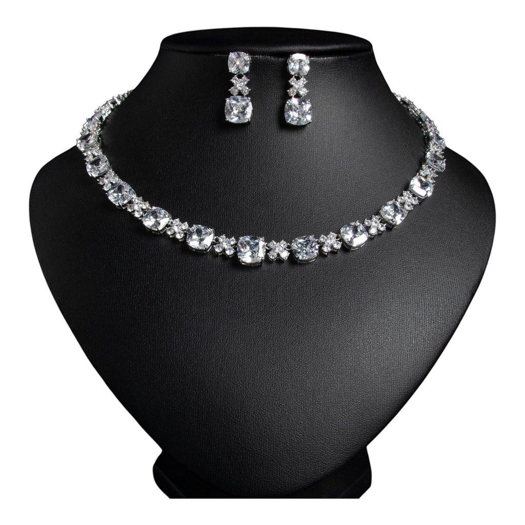 The Accessory Bar Sahara Set featuring a choker necklace and drop earrings with clear cushion-cut cubic zirconia stones.