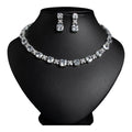The Accessory Bar Sahara Set featuring a choker necklace and drop earrings with clear cushion-cut cubic zirconia stones.