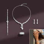 The Accessory Bar 4-piece silver-tone jewelry set with clear cubic zirconia, including necklace, earrings, and ring.