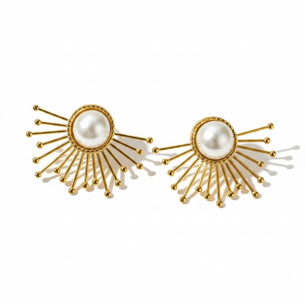 The Accessory Bar starburst stud earrings in 18K gold-plated stainless steel with imitation pearl centers.