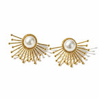 The Accessory Bar starburst stud earrings in 18K gold-plated stainless steel with imitation pearl centers.