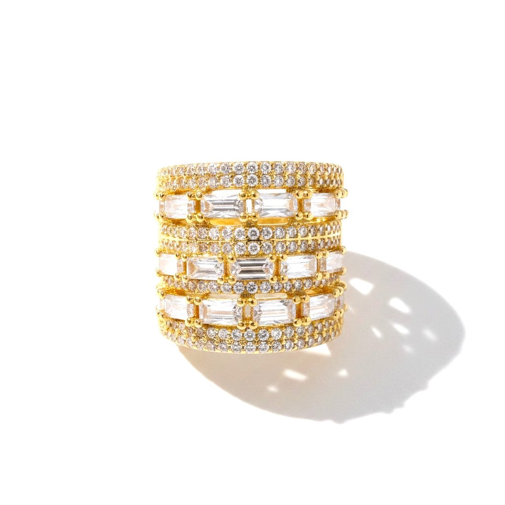 The Accessory Bar Tala wide-band gold-plated ring featuring baguette and pavé cubic zirconia stones.