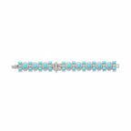 The Accessory Bar The Turk bracelet featuring oval turquoise stones surrounded by sparkling pavé crystals in silver