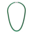 The Accessory Bar Verde tennis necklace in silver-tone rhodium-plated steel with emerald green baguette-cut crystals.