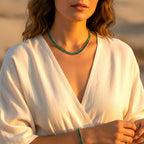 Model wearing The Accessory Bar Verde emerald green baguette tennis necklace in rhodium-plated stainless steel.