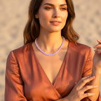 Model wearing The Accessory Bar Verde tennis necklace in blush pink cubic zirconia on rhodium-plated stainless steel.