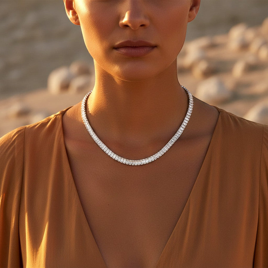 The Accessory Bar Verde tennis necklace in silver-tone rhodium-plated steel with baguette-cut cubic zirconia stones.