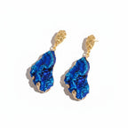 The Accessory Bar The Zara earrings featuring textured blue cubic zirconia drops set in 18K gold-plated stainless steel.