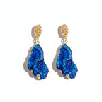 The Accessory Bar The Zara gold-plated stainless steel drop earrings with textured blue cubic zirconia stones.